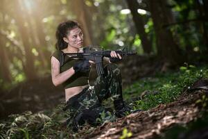 Special force with the gun in the jungle photo