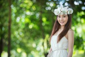 pretty Asian girl with birds crown photo