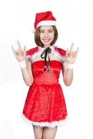 Pretty Asian girl in Santa costume for Christmas on white background photo