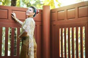 Beautiful Thai girl in Thai traditional costume photo