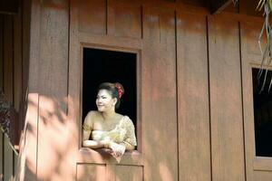 Beautiful Thai girl in Thai traditional costume photo