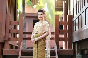 Beautiful Thai girl in Thai traditional costume photo