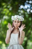 pretty Asian girl with birds crown photo