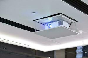 Projector on the ceiling in conference room. photo