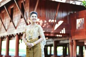 Beautiful Thai girl in Thai traditional costume photo