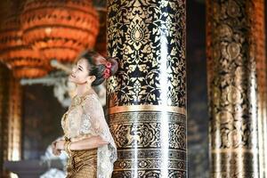 Beautiful Thai girl in Thai traditional costume photo