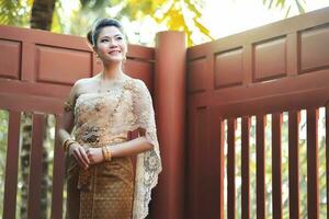 Beautiful Thai girl in Thai traditional costume photo