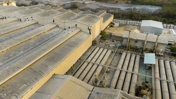 Toxic fumes spread from the roof of an industrial plant. Industrial plants emit large amounts of smoke from the factories during production. which creates air pollution for the world. photo