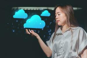 Businesswoman holding cloud computing icons. Cloud computing concept. Double exposure photo