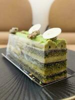 Pistachio opera cake  from homemade bakery photo