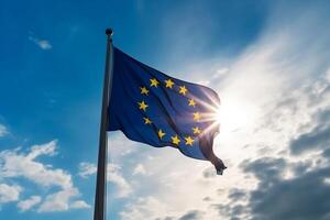 The flag of the European Union against the blue sky. photo