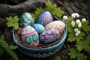 Colorful easter eggs in basket at nature background. Patterned on eggs. photo