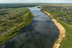 panoramic view from a high altitude on river in the forest photo