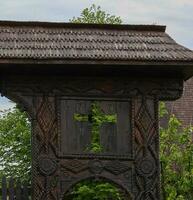 Old church gate made with dark oak wood in Alba Iulia , Romania photo