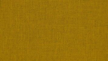 Yellow velvet fabric texture used as background. Empty yellow fabric background of soft and smooth textile material. There is space for text. photo