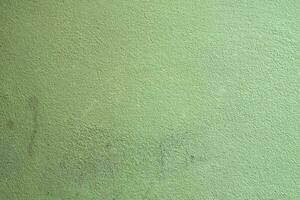 Green vintage wall backdrop texture background, Grunge green background peeling distressed paint photo