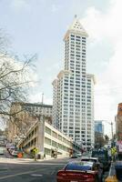 Seattle, Washington, USA. March 2020. Smith Tower on a clear Sunny day and Parking lot Sinking ship photo