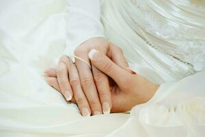 Beautiful wedding French manicure of the bride photo