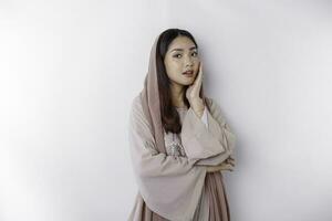 Portrait of a young beautiful Asian Muslim woman wearing a headscarf, beauty shoot concept photo