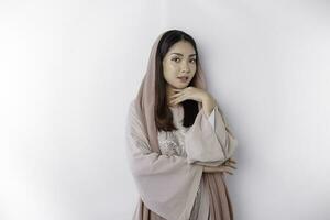 Portrait of a young beautiful Asian Muslim woman wearing a headscarf, beauty shoot concept photo