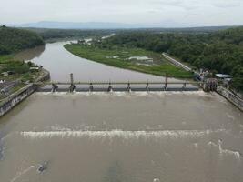 Aerial small dam river in big river Indonesia photo