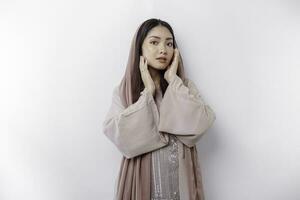 Portrait of a young beautiful Asian Muslim woman wearing a headscarf, beauty shoot concept photo