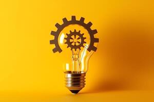 Light bulb with gears ideas concept yellow background. photo