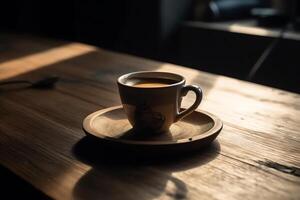 Cup of coffee on wooden table. photo