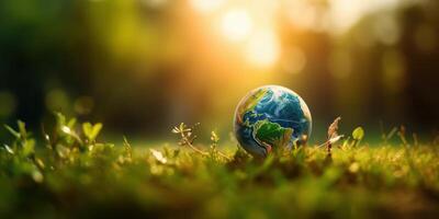 Planet earth on green background. World environment day and Earth day. photo