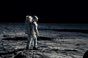 An astronaut standing on the moon looking at a large earth like planet. photo