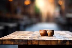 Empty wooden table in front of abstract blurred background product display in a coffee shop local market or bar. photo