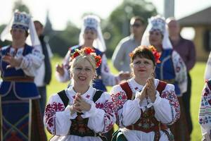 08 29 2020 Belarus, Lyaskovichi. Celebration in the city. Women in national Slavic clothes at the celebration. photo