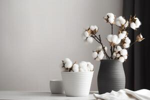 A Serene Still Life of Cotton Branches in a White Vase. photo