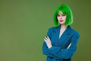 Pretty young female Glamor green wig red lips blue jacket green background unaltered photo