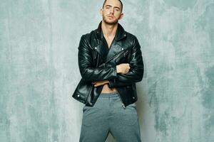handsome man in leather black jacket fashion confidence to you Studio photo
