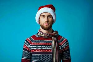 handsome man new year clothes christmas holiday blue background photo