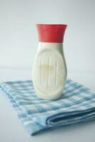 close up of Mayonnaise in container on table . photo