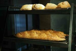Freshly baked bread lies on the shelves ready for sale. photo