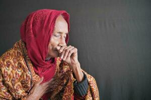 senior women coughing and sneezes photo