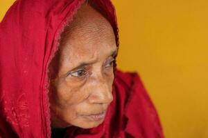 sad elderly women looking away photo