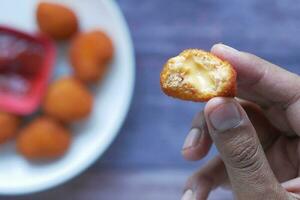 close up of chicken cheese meat ball on plate photo