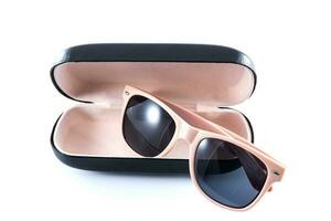 pink sunglasses in black opened case photo