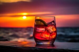 Cocktail on tropical sunset beach abstract background drink and summer concept. photo