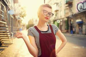 short haired woman outdoors cup with drink walk summer photo