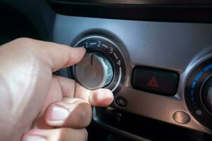 selectively focus on the air conditioner AC control panel on the car dashboard. soft focus. under exposure photo