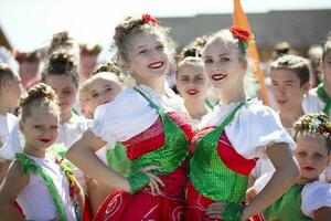 August 29, 2020 Belarus, Gomil. City holiday. Two girls dancers in colorful costumes. photo