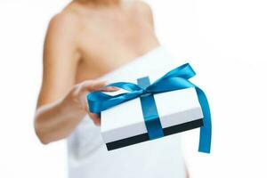 Picture of nice blonde woman holding gift or voucher photo