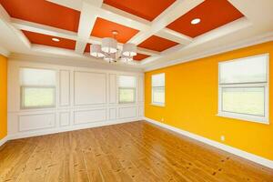 Beautiful Bold Red and Yellow Custom Master Bedroom Complete with Entire Wainscoting Wall, Fresh Paint, Crown and Base Molding, Hard Wood Floors and Coffered Ceiling photo