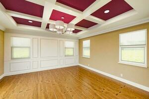 Beautiful Purple and Tan Custom Master Bedroom Complete with Entire Wainscoting Wall, Fresh Paint, Crown and Base Molding, Hard Wood Floors and Coffered Ceiling photo