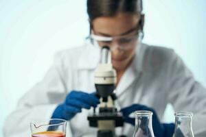 female laboratory assistant at work table microscope professional photo